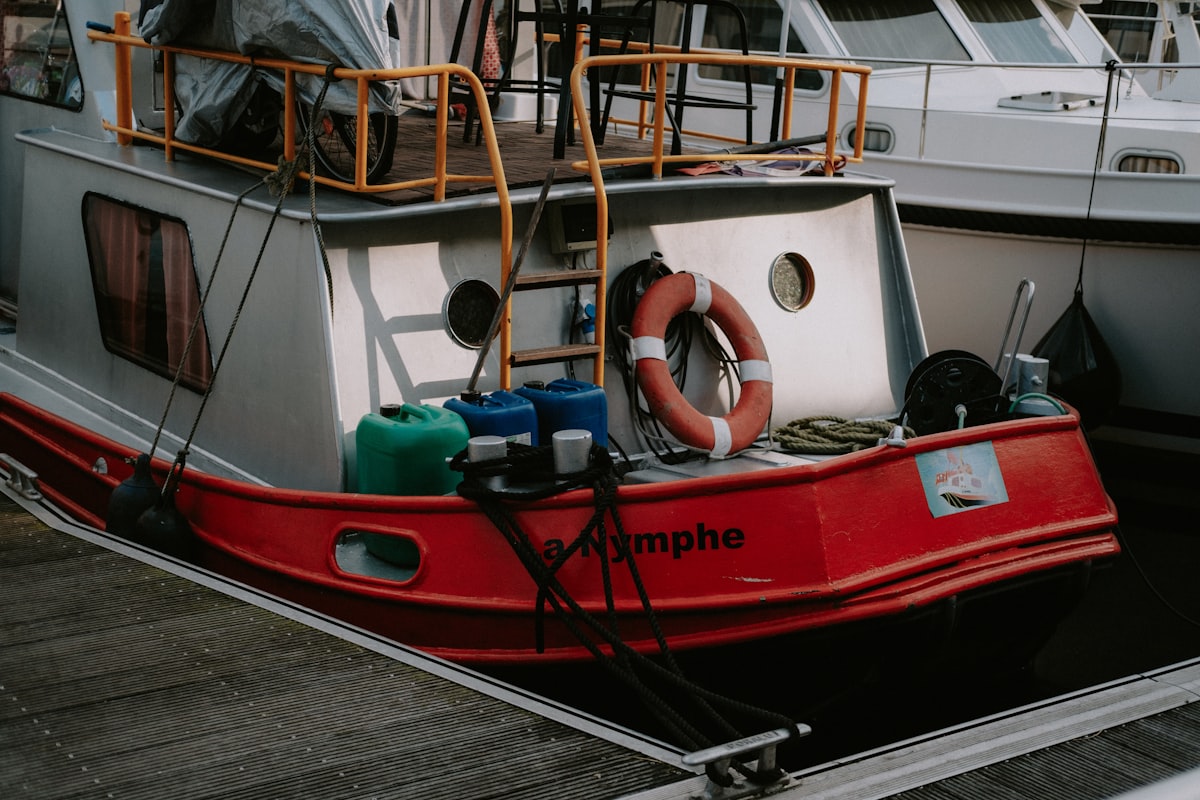 a red and white boat docked at a dock related to The Ultimate Dockside Experience: Uniting Two Loves