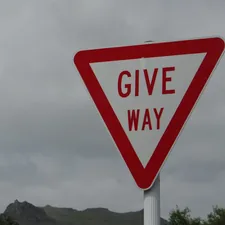 a red and white sign that says give way related to The Cheapest Way to Get Rid of Bed Bugs