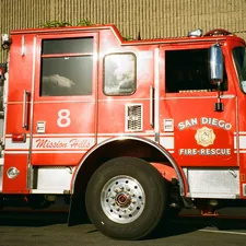 A red san diego fire-rescue truck with number 8 related to The Ultimate Guide to Fire Truck Baby Bedding: Add a Dash of Adventure to Your Nursery