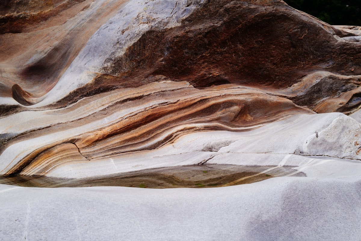 A rock formation with white and brown rocks related to Uncovering the Secrets of Agate Fossil Beds