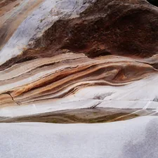 A rock formation with white and brown rocks related to Uncovering the Secrets of Agate Fossil Beds