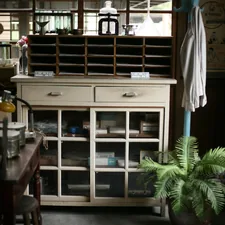 a room filled with furniture and a potted plant related to Stunning Storage Solutions: Elevate Your Dining Space with Antique White Sideboard Buffets