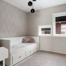A room with a bed and a desk in it related to 10 Reasons to Choose a Toddler Bed with Storage for Your Little One