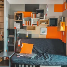 a room with a couch and shelves related to The Ultimate Space Saver: Friheten Sofa Bed