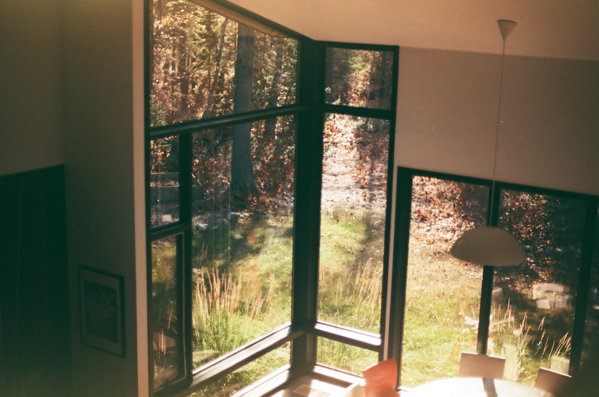 a room with a large window and a lamp related to Design Ideas for Large Windows with Roomy Valances