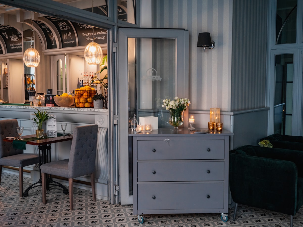 a room with a table and chairs related to Small Mirrored Sideboards for Compact Spaces