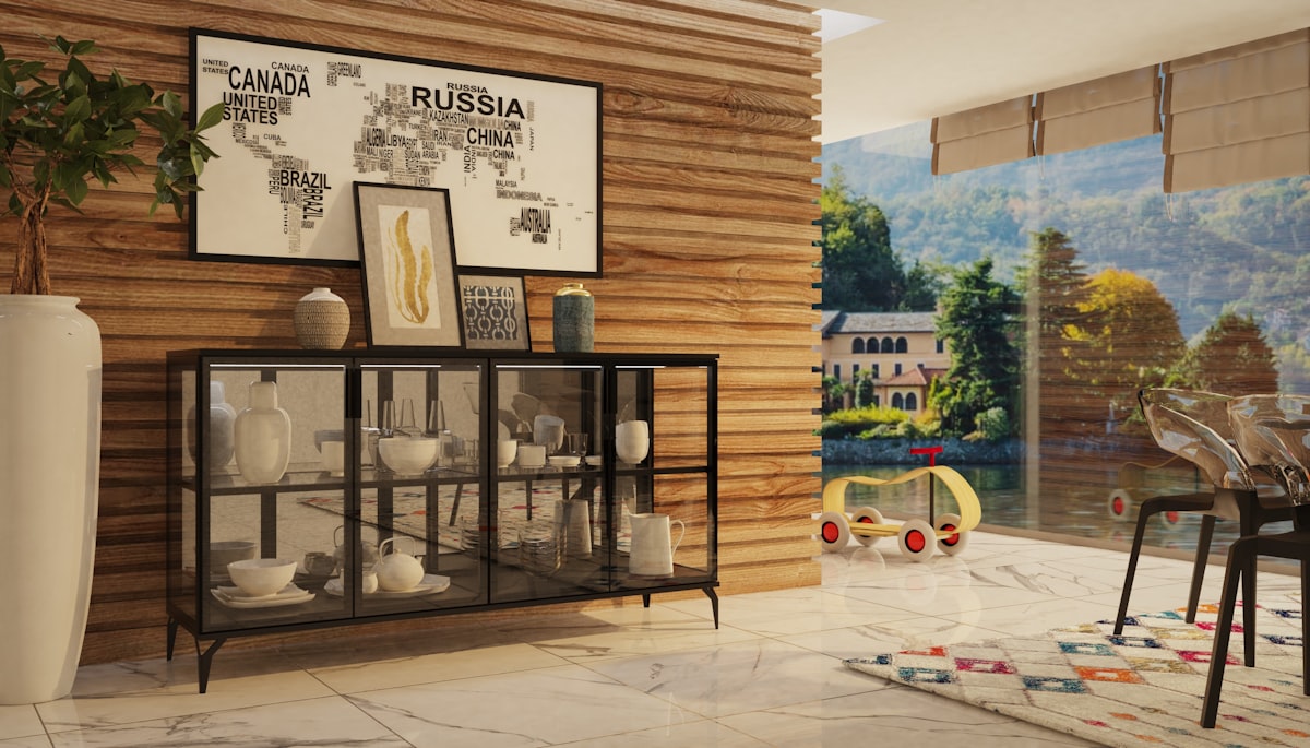 a room with a table, chairs, and pictures on the wall related to Elevate Your Dining Room with a Glass Front Buffet Sideboard