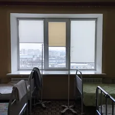A room with two beds and a window related to Essential Accessories for a Comfortable Sleep: Bed Rails for Twin Bed