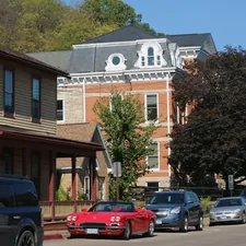 a row of cars parked on the side of a road related to Experience the Best of Bed and Breakfast Galena IL