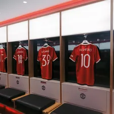 a row of lockers with jerseys on them related to Elevate Your Soccer Room with Stylish Curtain Valances