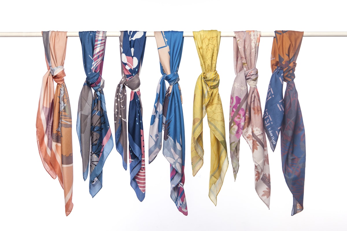 a row of scarves hanging from a clothes line related to Hang Your Scarf Valance: Creative & Stylish Ideas