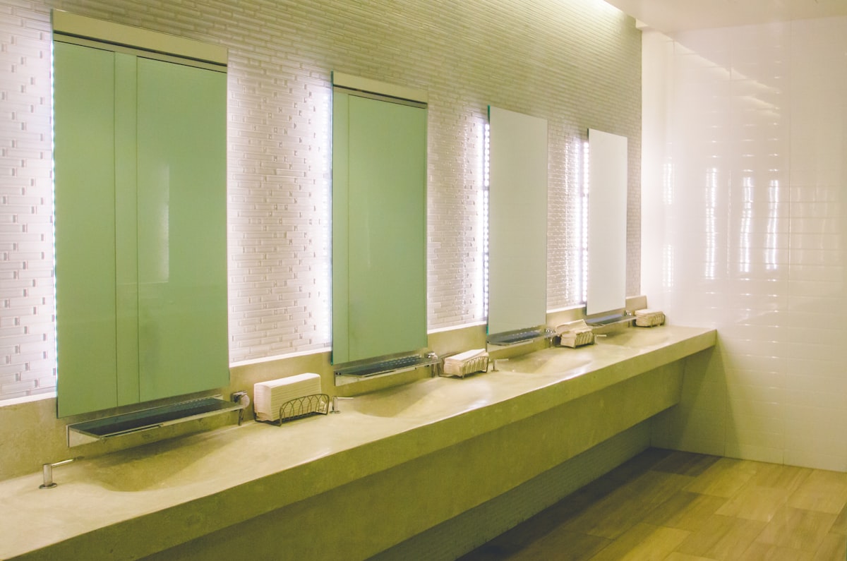 a row of sinks in a public restroom related to Bathroom Window Valance
