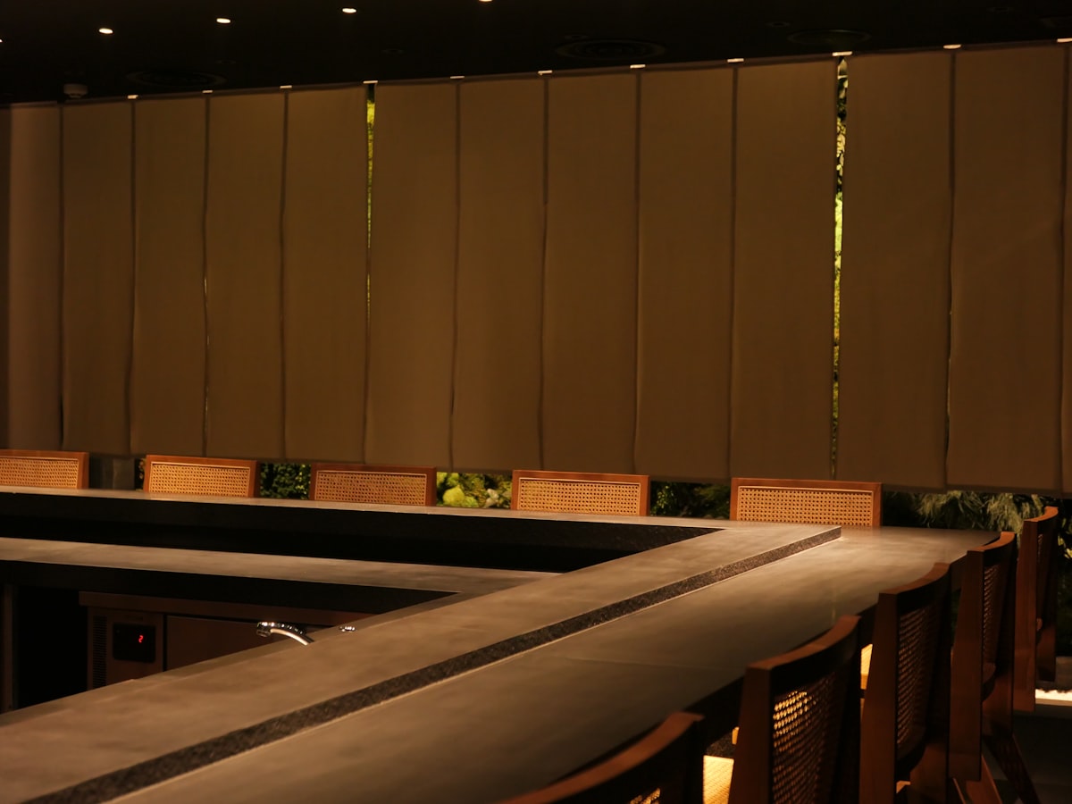 a row of wooden benches sitting next to a wall related to Faux Roman Shade Valances: A Stylish Decor Solution