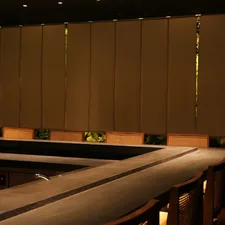 a row of wooden benches sitting next to a wall related to Faux Roman Shade Valances: A Stylish Decor Solution