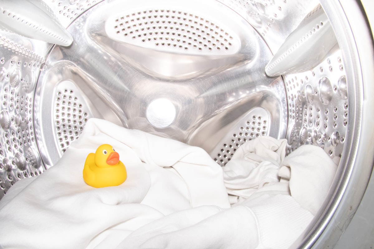 a rubber ducky toy sitting inside of a washing machine related to Conquering Bed Bugs:  The Laundry Detergent Weapon
