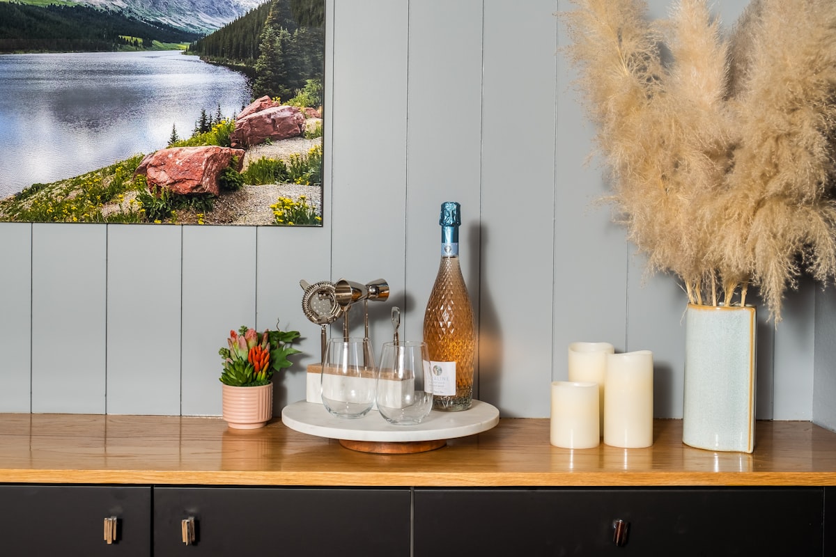 A rustic wooden countertop adorned with wine essentials. related to Black Sideboard Buffet Ideas