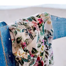 a scarf draped over a blue wooden bench related to Scarf Valence Pattern Ideas
