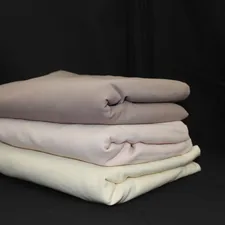 a sculpture of a person's face related to Wrap Yourself in Luxury: King Size Coverlet Collection