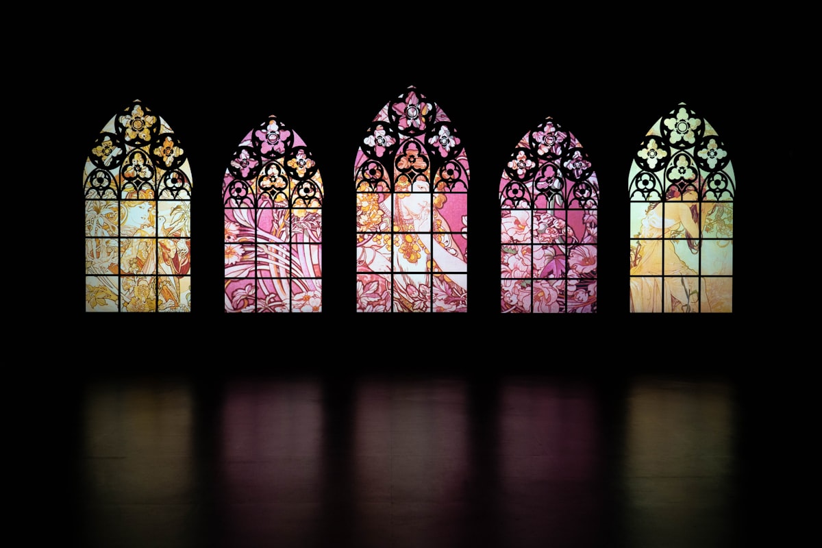 a set of four stained glass windows in a dark room related to Floral Window Valances