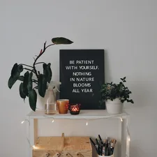 a shelf with a plant and a sign on it related to Elevate Your Decor with Victory Swag Valances