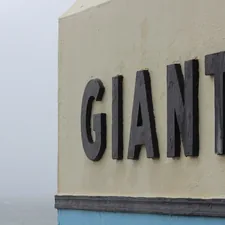 a sign on the side of a building that says giant related to Ultimate Guide to NY Giants Bedding