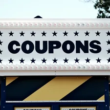 a sign that says coupons on it related to Score Big Savings with Bed Bath & Beyond Coupons