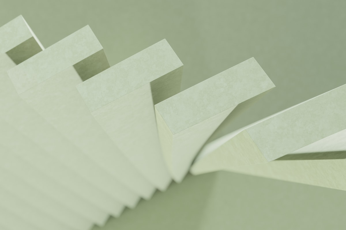 a stack of white papers sitting on top of a table related to Latex-Free Coverlet Adhesive Dressings for Sensitive Skin