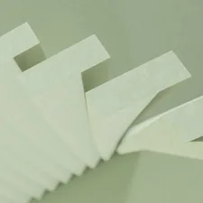 a stack of white papers sitting on top of a table related to Latex-Free Coverlet Adhesive Dressings for Sensitive Skin