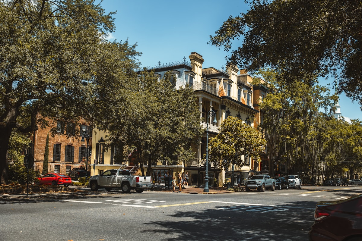 a street with cars parked on the side of it related to Savannah B&B Cottages