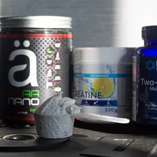 a table topped with bottles of vitamins and pills related to Benefits of Taking BCAA Before Bed