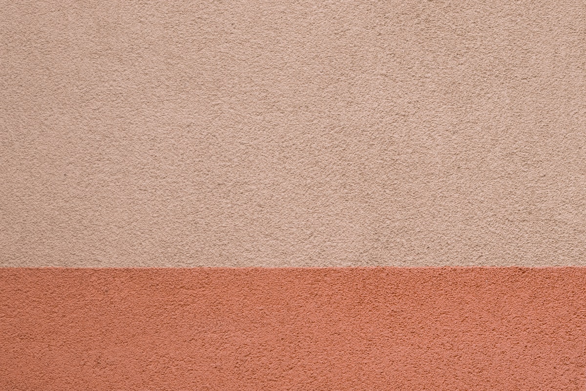 A textured wall with two distinct color blocks. related to The Timeless Appeal of Terra Cotta Chimineas