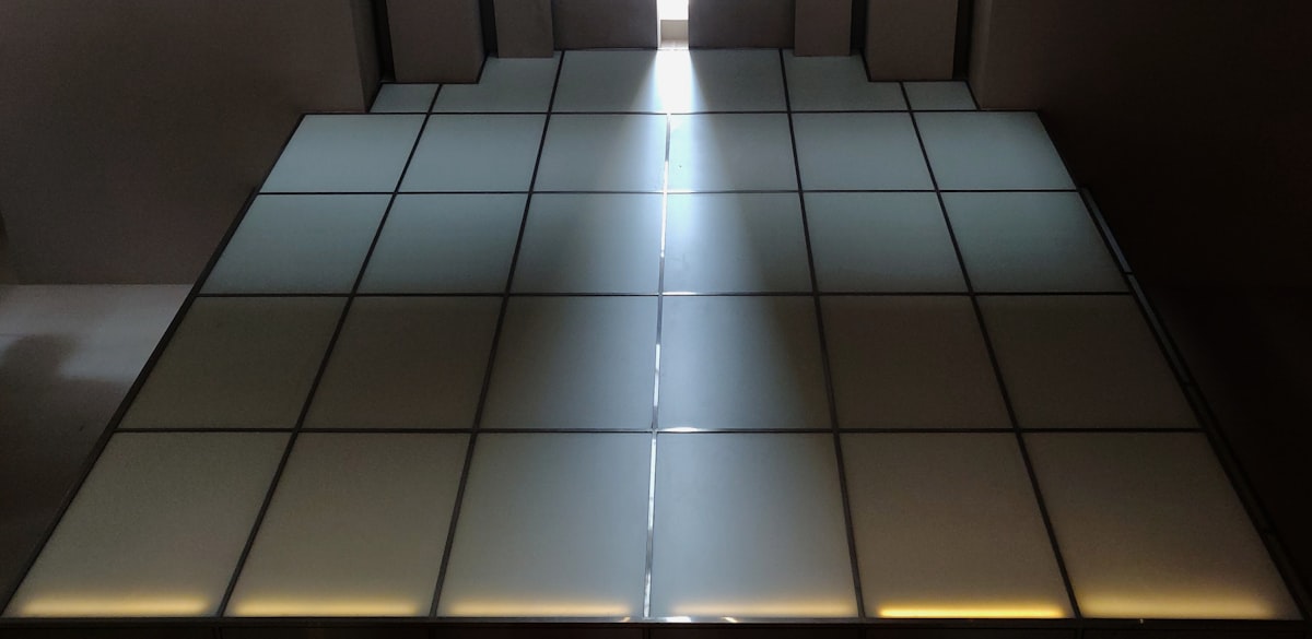 a tiled floor with a light coming through the middle of it related to Transform Your Sleep: The Benefits of a LED Bed Frame