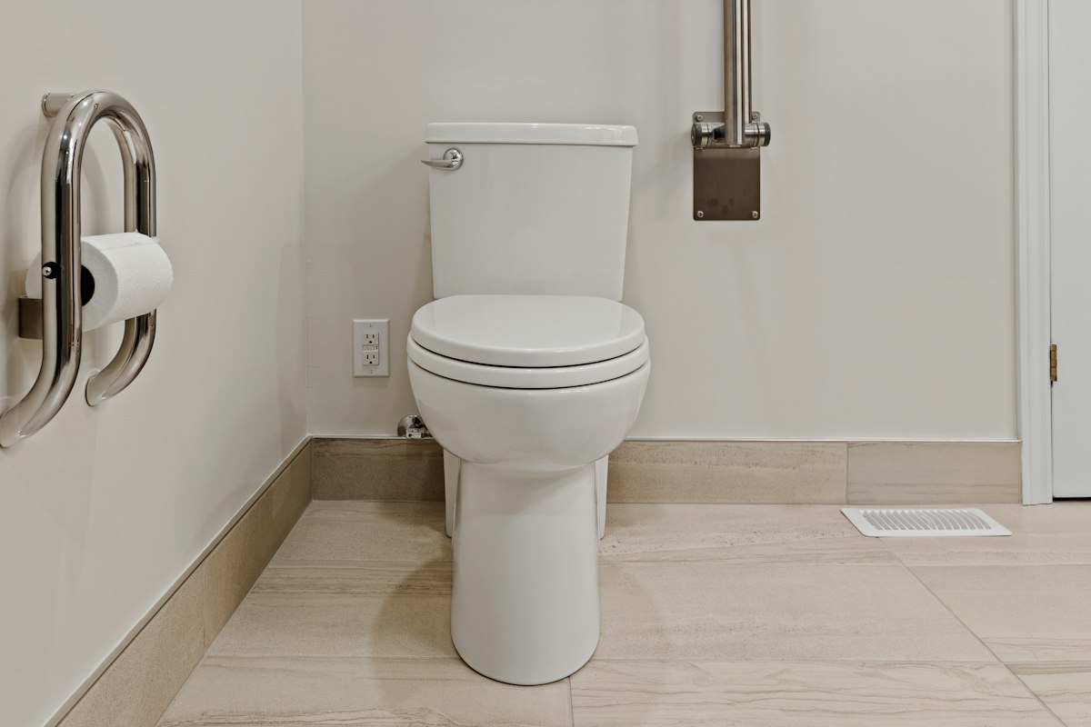 a toilet in a bathroom related to Why a Bidet for Toilet is the Ultimate Upgrade for Your Bathroom