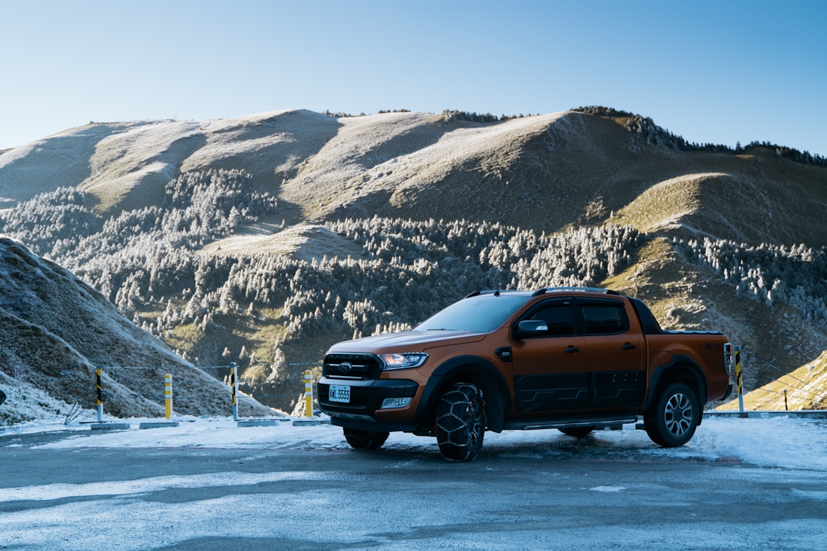 a truck is parked in the snow near a mountain related to Ford Ranger Valance: Upgrade Your Truck's Style and Protection