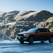 a truck is parked in the snow near a mountain related to Ford Ranger Valance: Upgrade Your Truck's Style and Protection