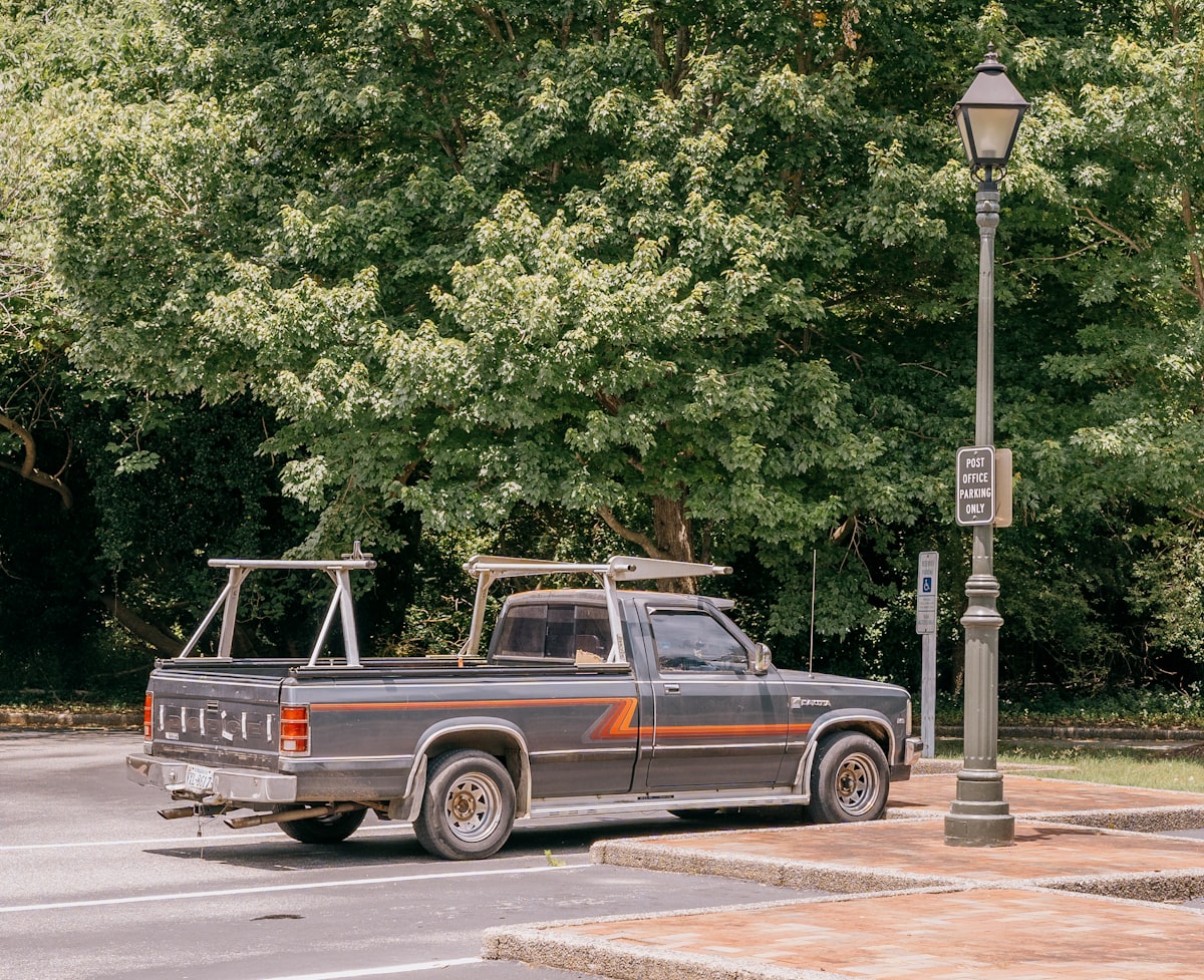 A truck parked in a parking lot next to a lamp post related to Upgrade Your Truck Bed: The Ultimate Guide to Lund Bed Extenders
