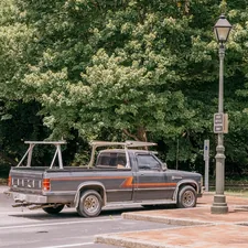 A truck parked in a parking lot next to a lamp post related to Upgrade Your Truck Bed: The Ultimate Guide to Lund Bed Extenders