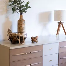 A vase with a plant on top of a dresser related to Elevate Your Home Decor with a Sideboard with Drawers