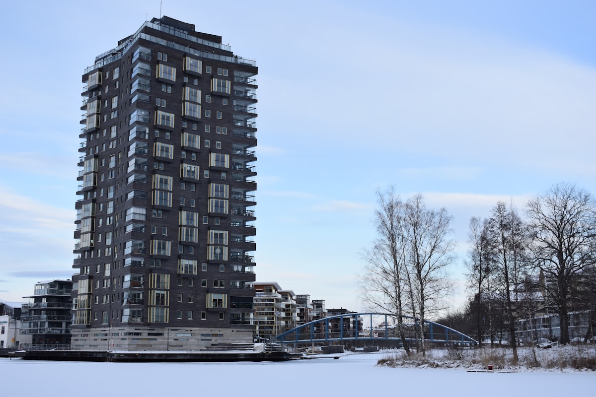 a very tall building sitting next to a bridge related to The Ultimate Guide to Karlstad Sofa Beds: Comfort and Style in One