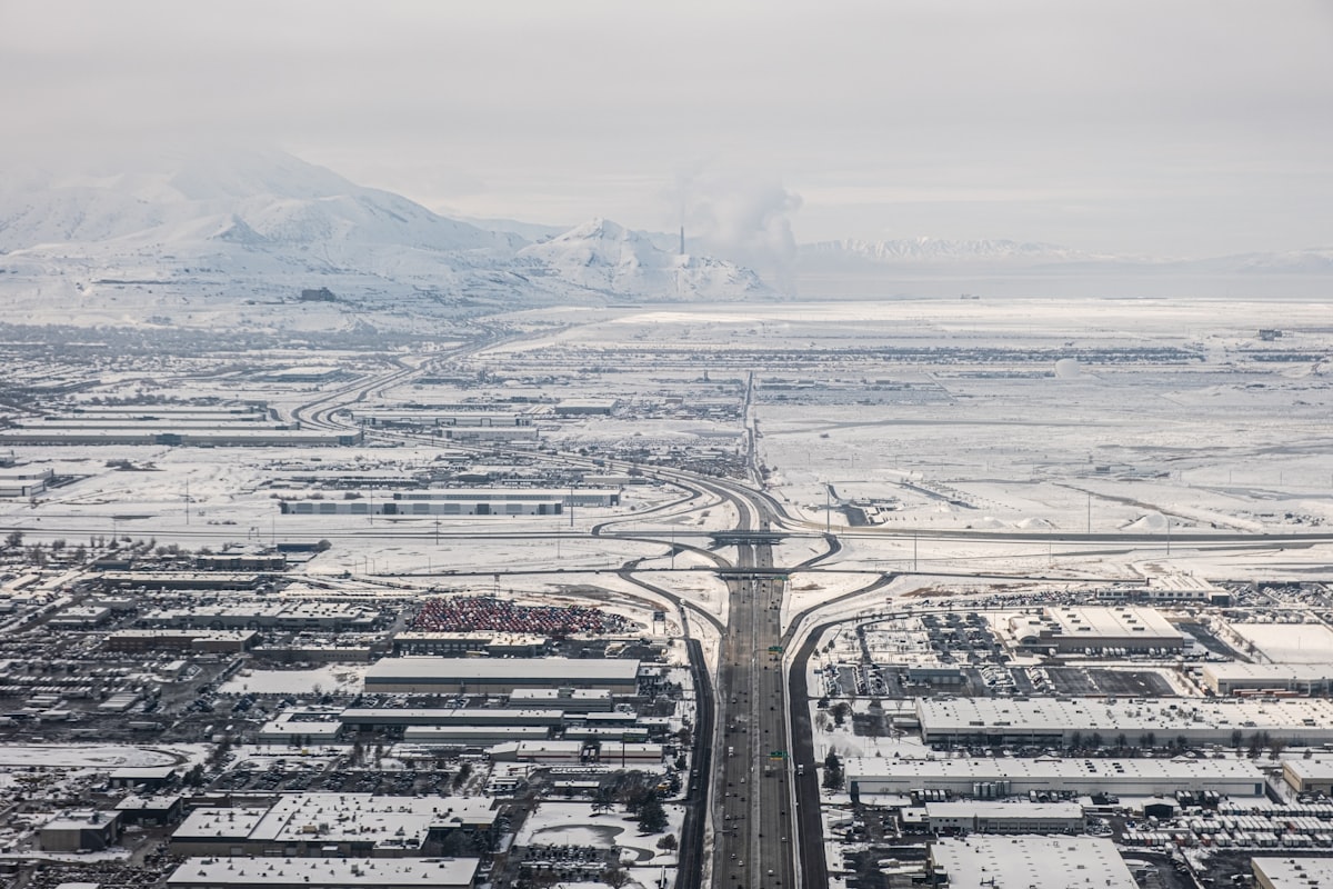 A view from Salt like City with snow and traffic and roads and mountains in the background related to Discover the Charm of Salt Lake City Bed and Breakfasts