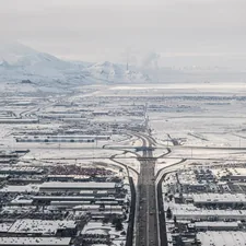 A view from Salt like City with snow and traffic and roads and mountains in the background related to Discover the Charm of Salt Lake City Bed and Breakfasts