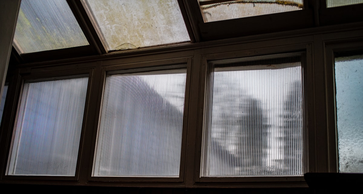a view of a building through three windows related to Mastering Window Treatments: How to Make Valances