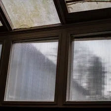 a view of a building through three windows related to Mastering Window Treatments: How to Make Valances