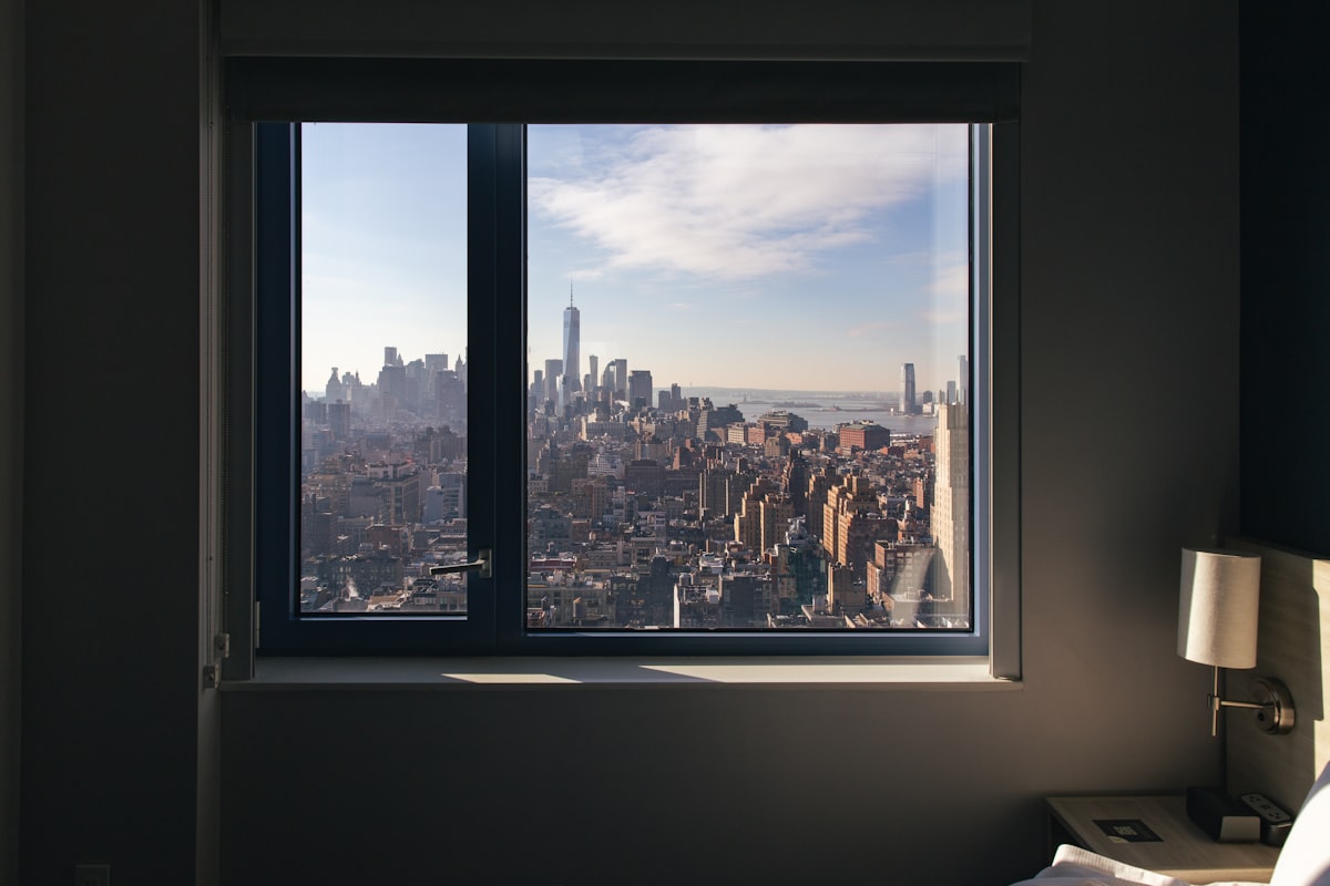 a view of a city from a window related to Transform Your Windows with Custom Made Valances