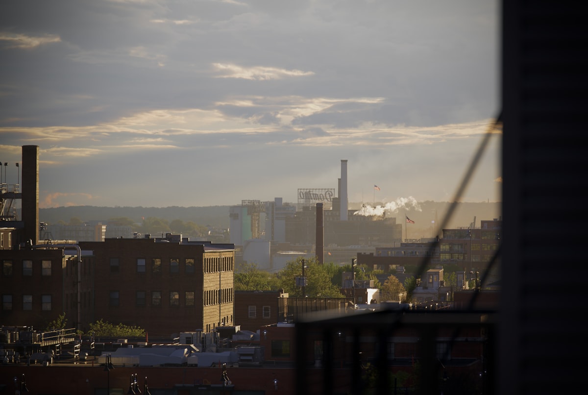 a view of a city with smoke stacks in the distance related to Discover the Charm of Baltimore Bed and Breakfasts: A Cozy Retreat Awaits