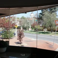 a view of a street through a window related to Custom Valances for Windows: Elevate Your Home's Style