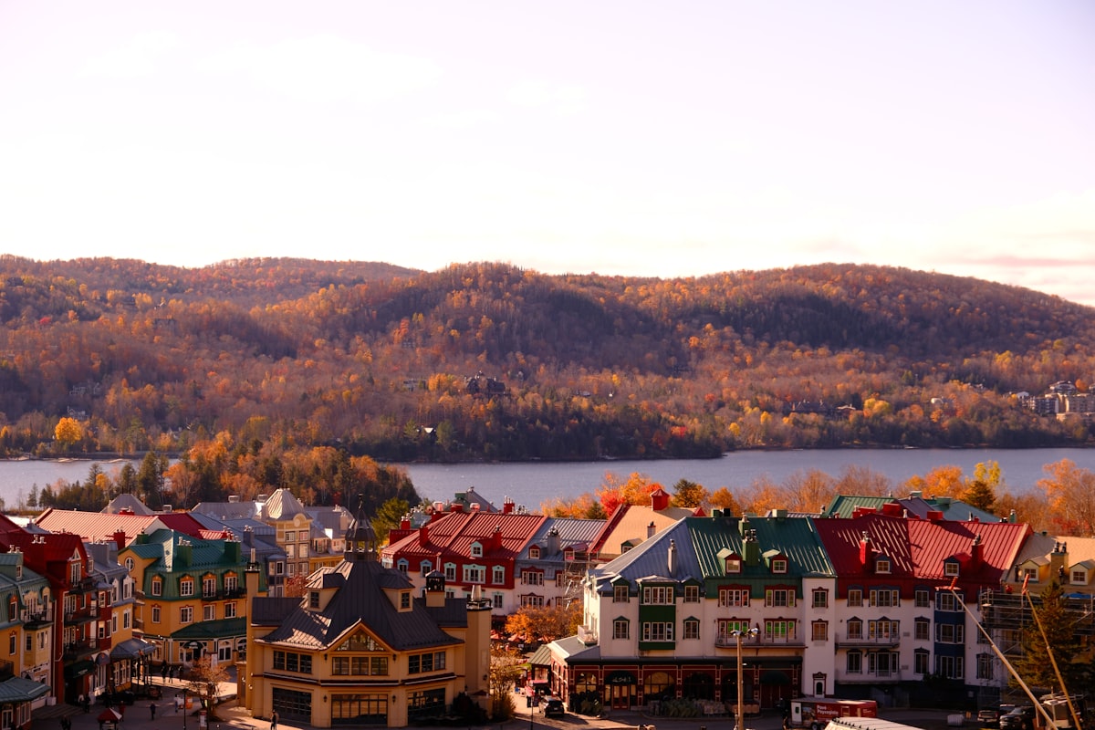 a view of a town with mountains in the background related to Charming Stays in Quebec City