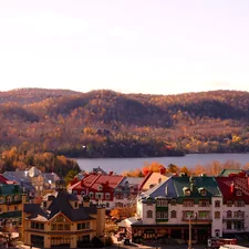 a view of a town with mountains in the background related to Charming Stays in Quebec City