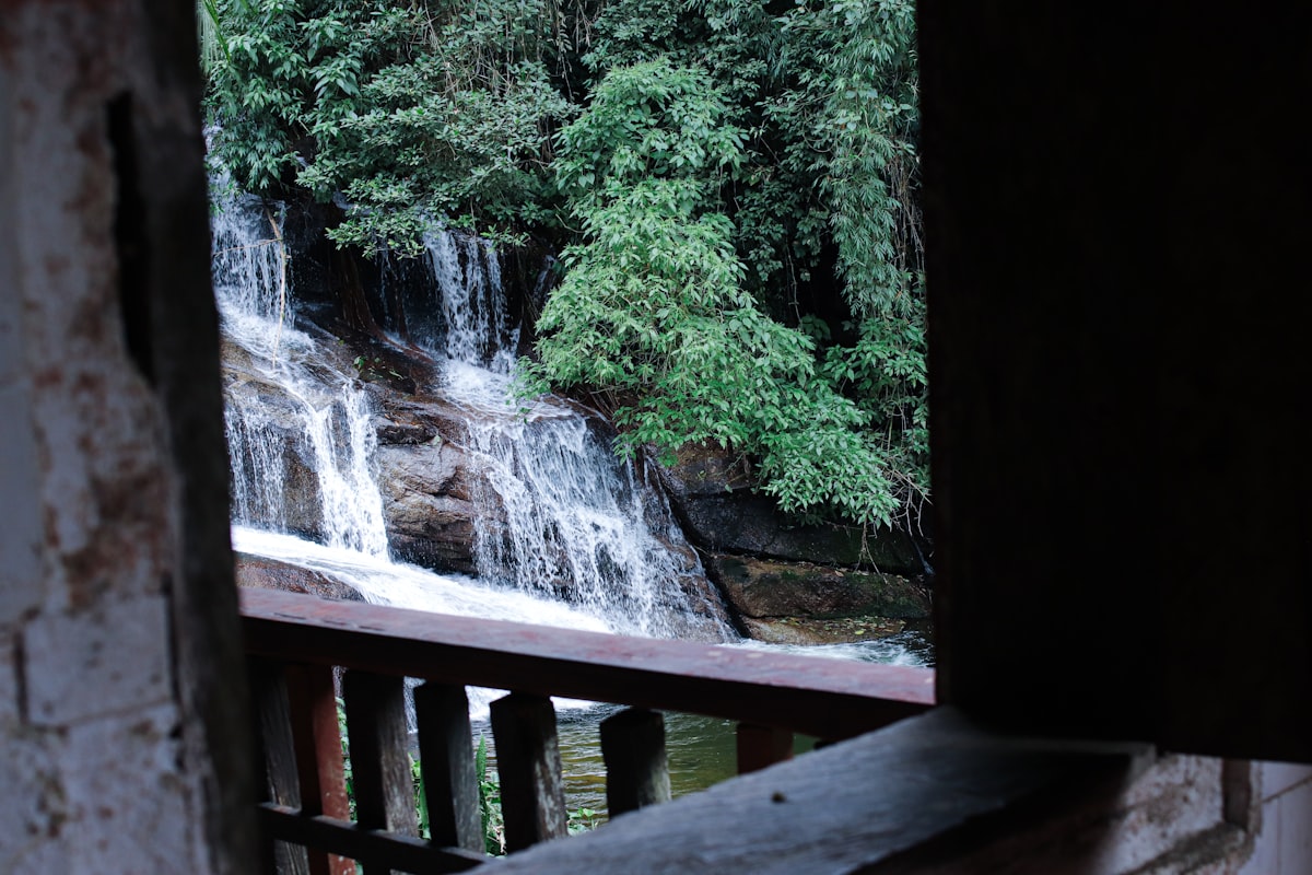 a waterfall with a bridge related to Elevate Your Windows with Waterfall Valances and Curtains
