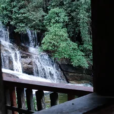 a waterfall with a bridge related to Elevate Your Windows with Waterfall Valances and Curtains